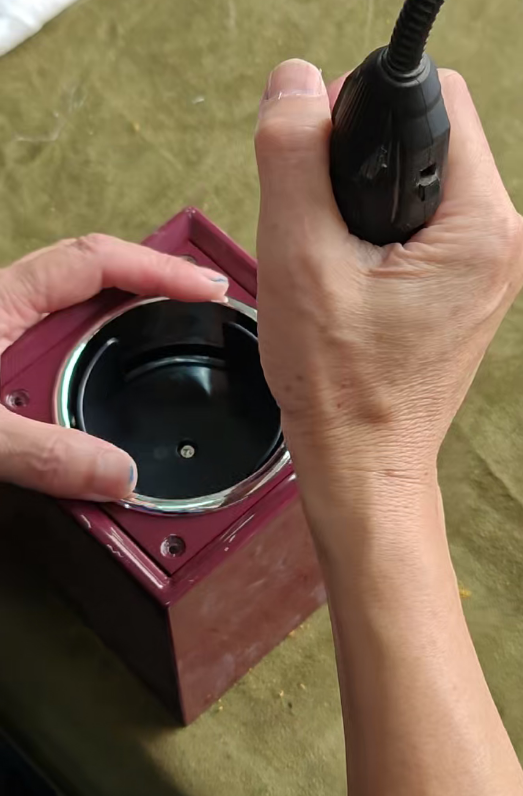 How to Customize a Single Watch Winder: Inside Our 8801 Red OEM Project插图 Worker fitting the chrome watch holder ring into the red 8801 watch winder casing