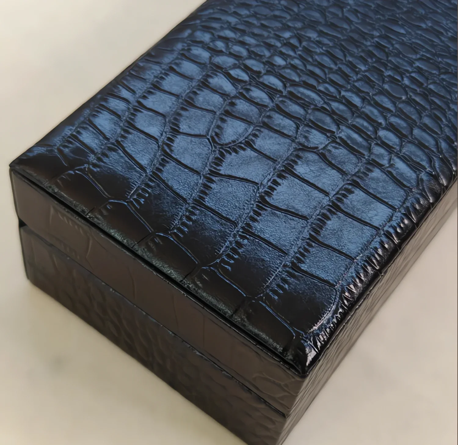 Crocodile Leather Jewelry Gift Box - Navy Embossed Case with Black Velvet Interior and Outer Sleeve 5 Close-up of the crocodile embossed navy leather texture on the jewelry gift box